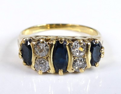Lot 2557 - A yellow metal sapphire and diamond half...