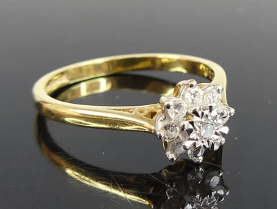 Lot 2675 - An 18ct yellow and white gold diamond cluster...