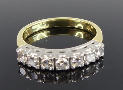Lot 2701 - A yellow and white metal diamond seven-stone...