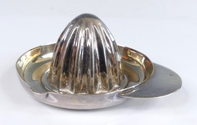 Lot 126 - A white metal lemon squeezer, in the form of a...