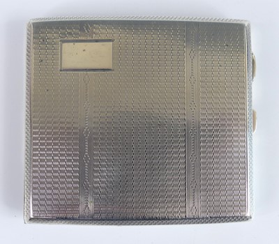 Lot 116 - An Art Deco silver engine turned pocket...