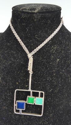 Lot 135 - A 1970s silver and enamel inset pendant,...