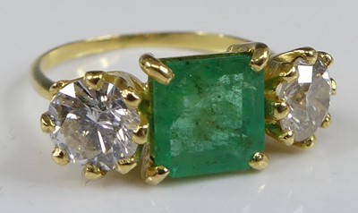 Lot 2103 - A yellow and white metal, emerald and diamond...