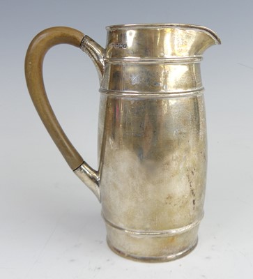 Lot 2073 - A George V silver milk jug, of tall barrel...