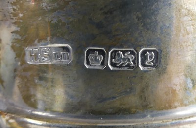 Lot 2073 - A George V silver milk jug, of tall barrel...