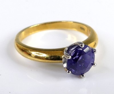 Lot 2826 - An 18ct yellow and white gold sapphire single...