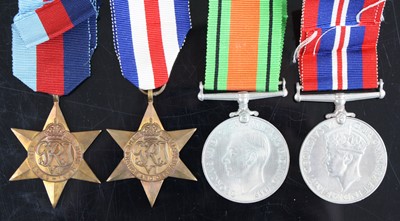 Lot 3018 - A group of four WW II medals to include...