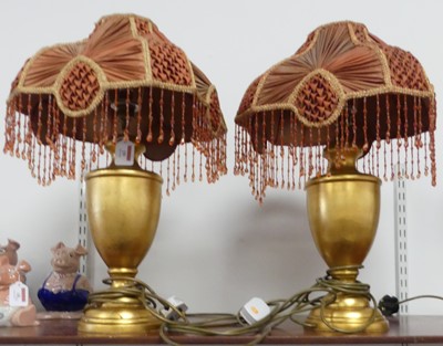 Lot 19 - A pair of contemporary gilt painted urn table...