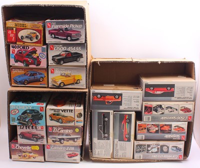 Lot 627 - 19 boxed and part started AMT/ERTL plastic...