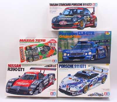 Lot 634 - A collection of five boxed mixed scale Tamiya...