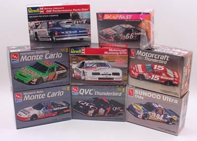 Lot 648 - A collection of seven boxed AMT/Ertl 1/25...