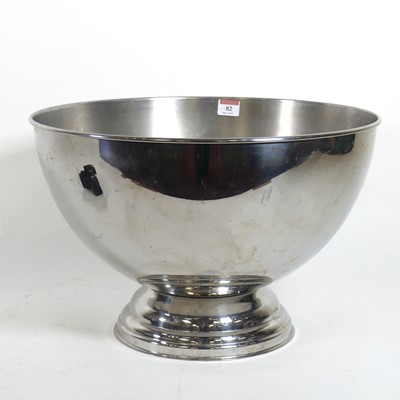 Lot 82 - A contemporary polished metal punch bowl, on a...