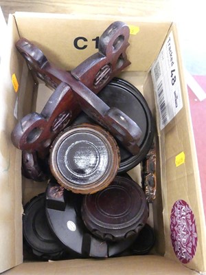 Lot 80 - A collection of Chinese turned wooden vase stands