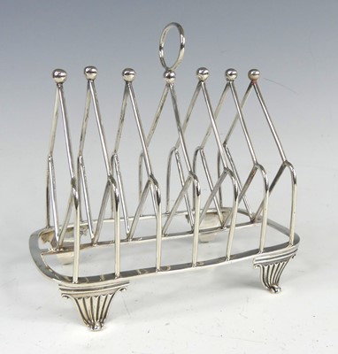 Lot 2078 - A George III silver six-division toastrack,...