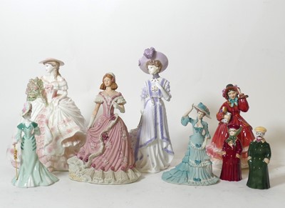 Lot 113 - A collection of porcelain figures, to include...