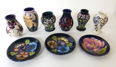 Lot 124 - A collection of Moorcroft pottery, to include...