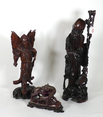 Lot 129 - A Chinese carved hardwood figure of Shou Lao...