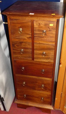 Lot 1122 - A hardwood narrow chest, containing four short...