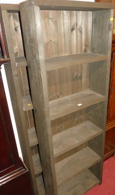 Lot 1129 - A pair of rustic stained pine freestanding...