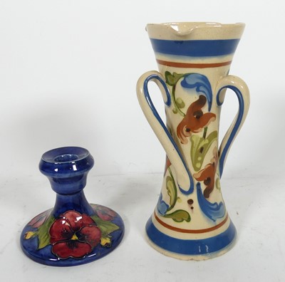 Lot 139 - A Moorcroft pottery chamber stick in the...