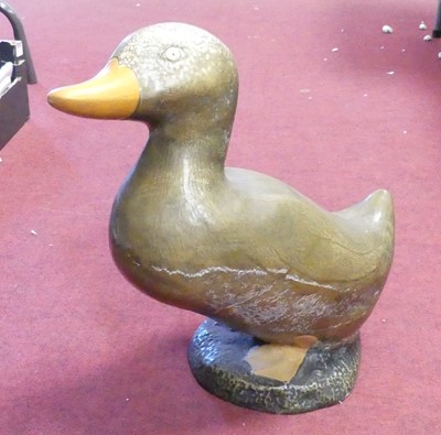 Lot 149 - A painted reconstituted stone figure of a duck,...