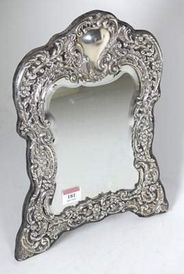 Lot 181 - A Victorian style repousse decorated silver...