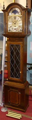 Lot 1152 - A contemporary oak three-train longcase clock,...