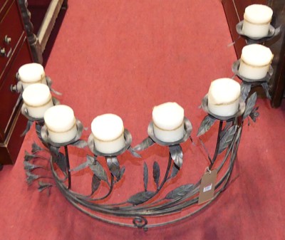 Lot 1181 - A rodded and pressed metal floral decorated...