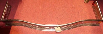 Lot 1190 - A 19th century cut steel fire fender, w.126cm,...