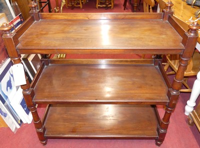 Lot 1199 - A Victorian mahogany three-tier buffet, raised...