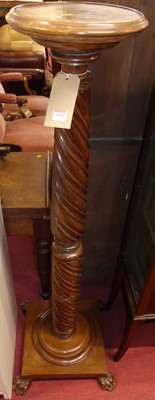 Lot 1204 - A spiral reeded and fluted walnut plantstand,...