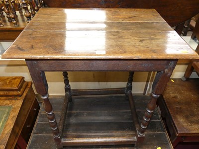 Lot 1207 - An antique joined oak plank topped rectangular...
