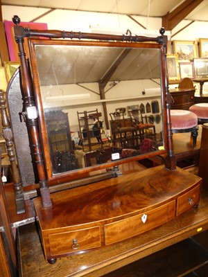 Lot 1219 - A Regency mahogany bowfront three-drawer...