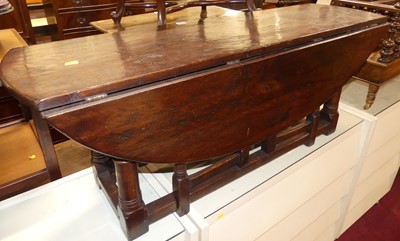 Lot 1222 - A contemporary joined oak dropflap coffee...