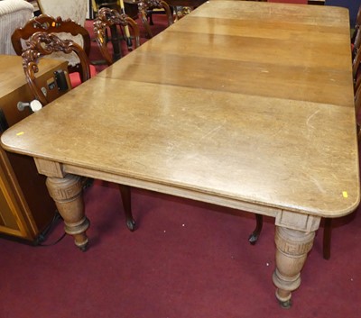Lot 1242 - A late Victorian oak round cornered extending...