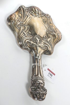 Lot 190 - An Art Nouveau hand mirror, the shaped...
