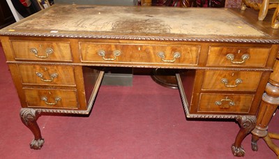 Lot 1247 - An early 20th century mahogany and tan leather...