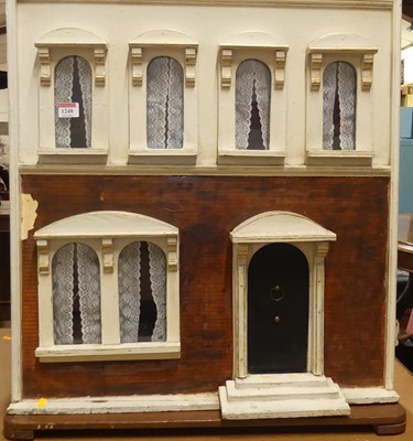 Lot 1248 - A painted two-storey dolls house (lacking...