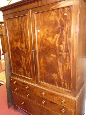 Lot 1259 - A Regency mahogany linen press, the twin...