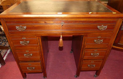 Lot 1303 - An Edwardian walnut compact kneehole writing...