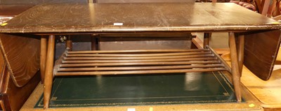 Lot 1309 - An Ercol dark elm dropflap low coffee table,...