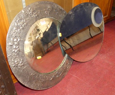Lot 1316 - A floral embossed pewter framed circular...