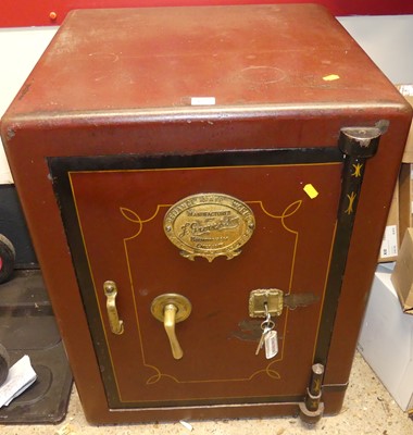 Lot 1322 - An early 20th century cast iron floor safe by...