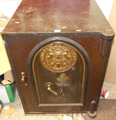 Lot 1323 - An early 20th century cast iron floor safe by...