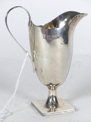 Lot 229 - An Edwardian silver cream jug, of helmet shape...