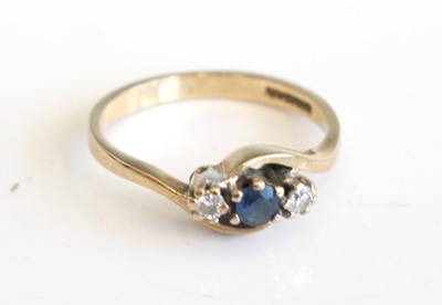 Lot 281 - A 9ct gold sapphire and diamond three stone...