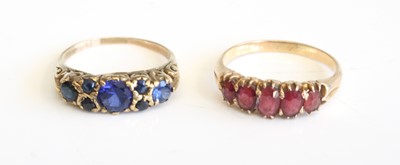 Lot 287 - A yellow metal and ruby set half hoop ring,...