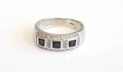 Lot 295 - A modern 9ct white gold sapphire three stone...