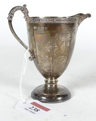 Lot 238 - A George V silver cream jug, of fluted form,...