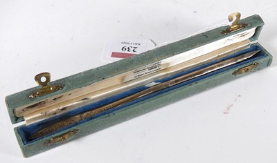 Lot 239 - A George V silver quill pen, the flattened tip...